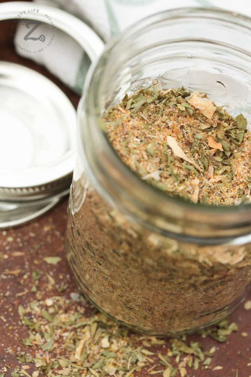 Overhead shot of dry Italian dressing mix in a glass jar