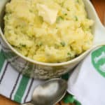 overhead of Irish Potato Recipe (Irish Champ) with butter on the top in a serving dish