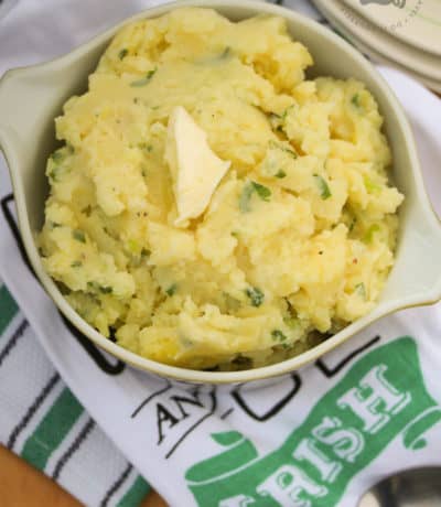 overhead of Irish Potato Recipe (Irish Champ) with butter on the top in a serving dish