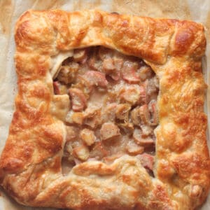 baked square rhubarb galette on a cookie sheet with parchment paper