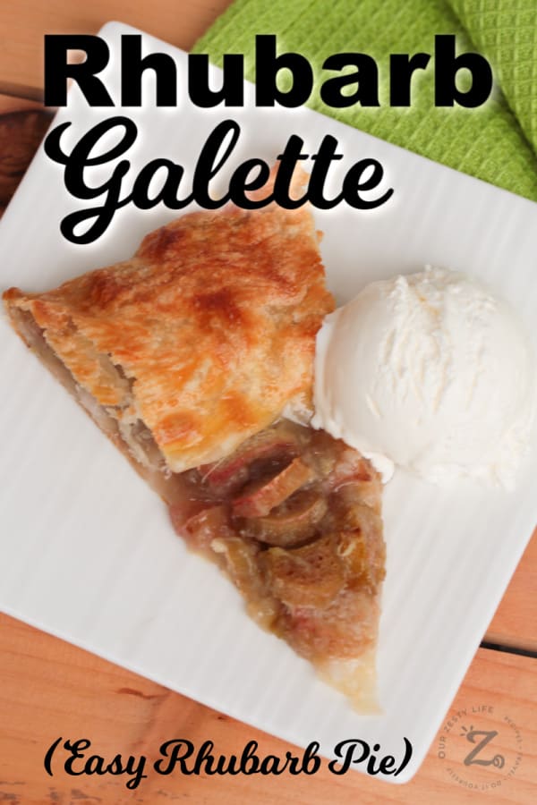 a slice of baked rhubarb galette (easy rhubarb pie on puff pastry) with a scoop of vanilla ice cream on a white plate