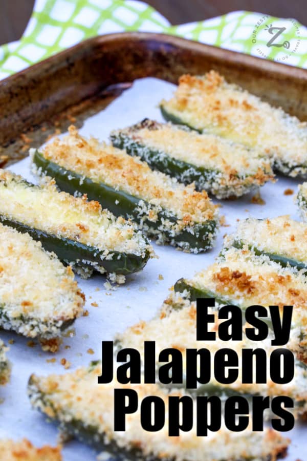 baking tray with parchment paper full of baked homemade easy jalapeno poppers