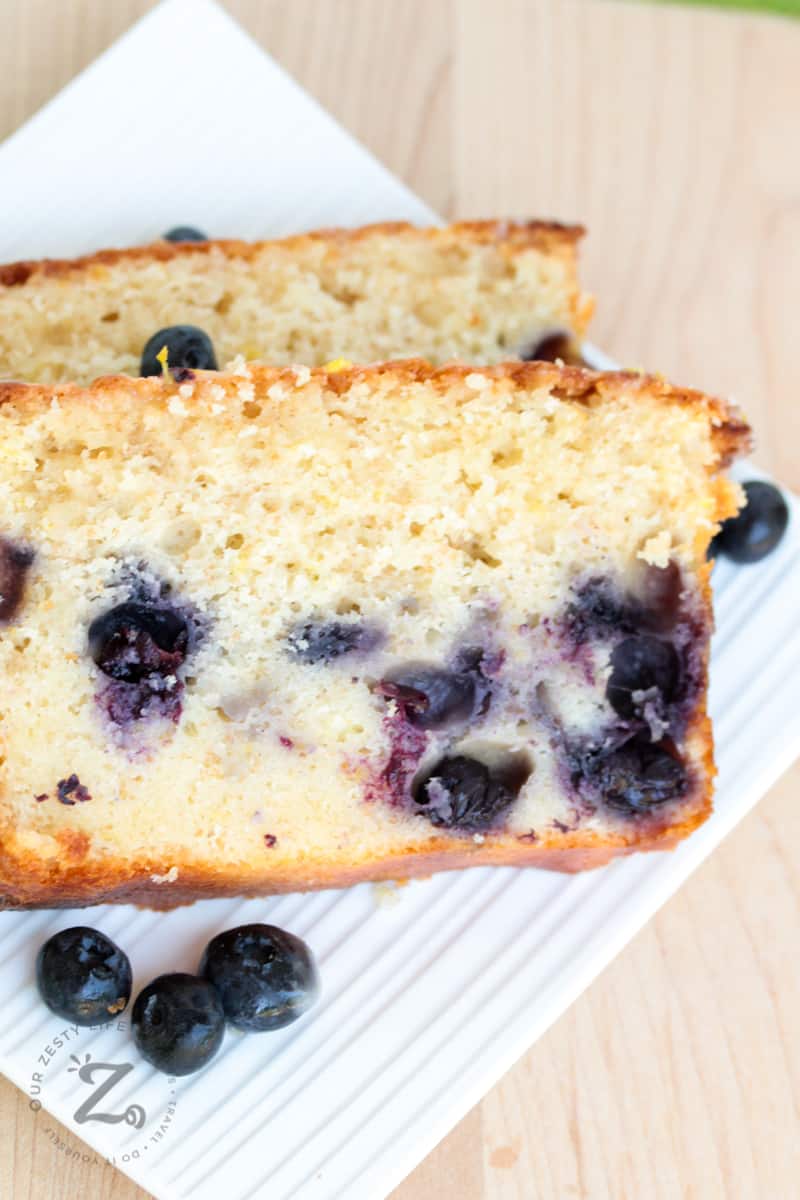 two slices of lemon blueberry loaf on a plate