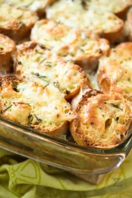 Breakfast strata with sausage baked in a glass dish.
