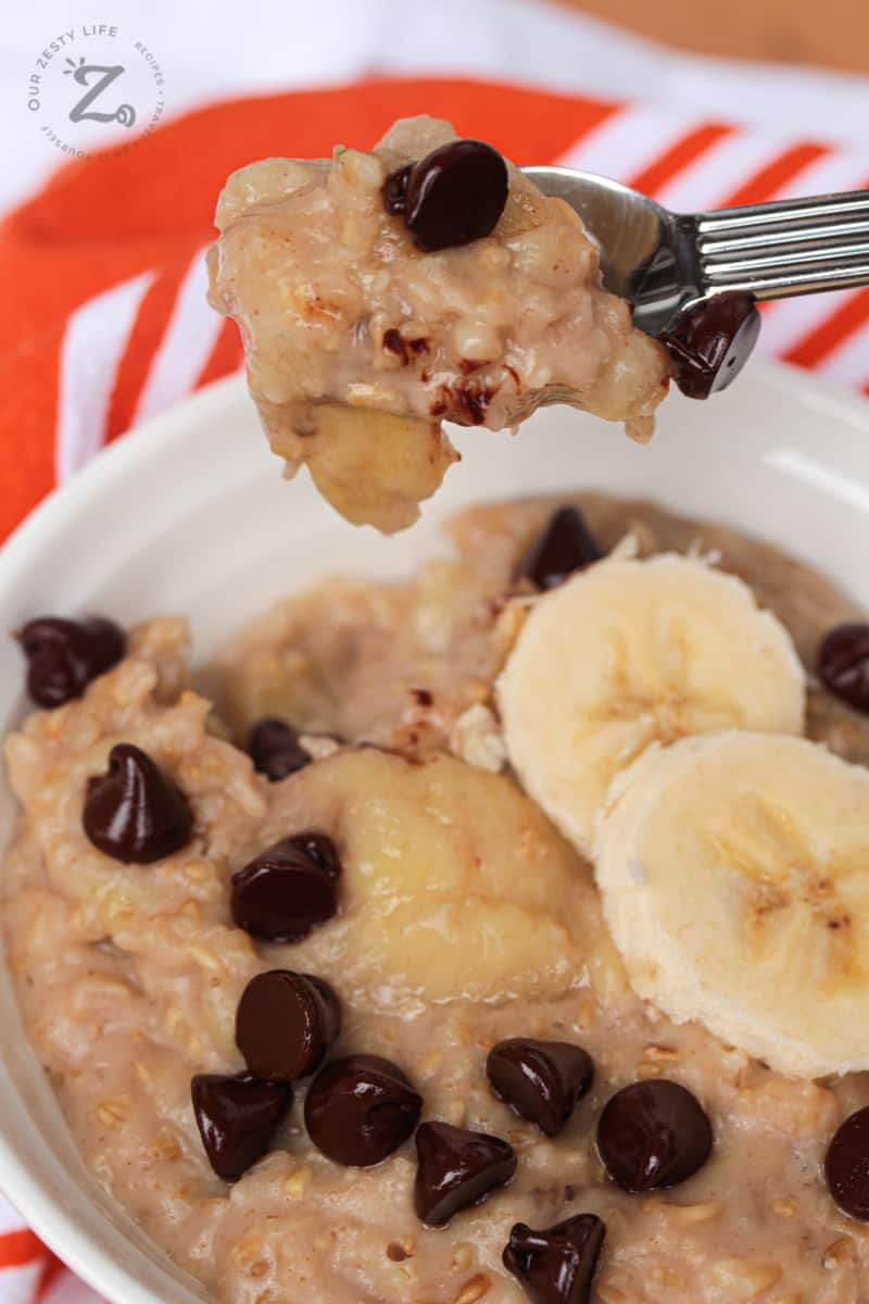 Peanut butter with banana oatmeal (chunky monkey) in a bowl and a close up of a spoonful of oatmeal.