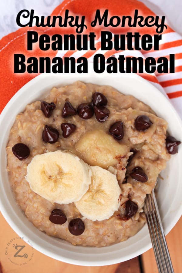 Overhead view of a bowl of peanut butter banana oatmeal with chocolate chips.