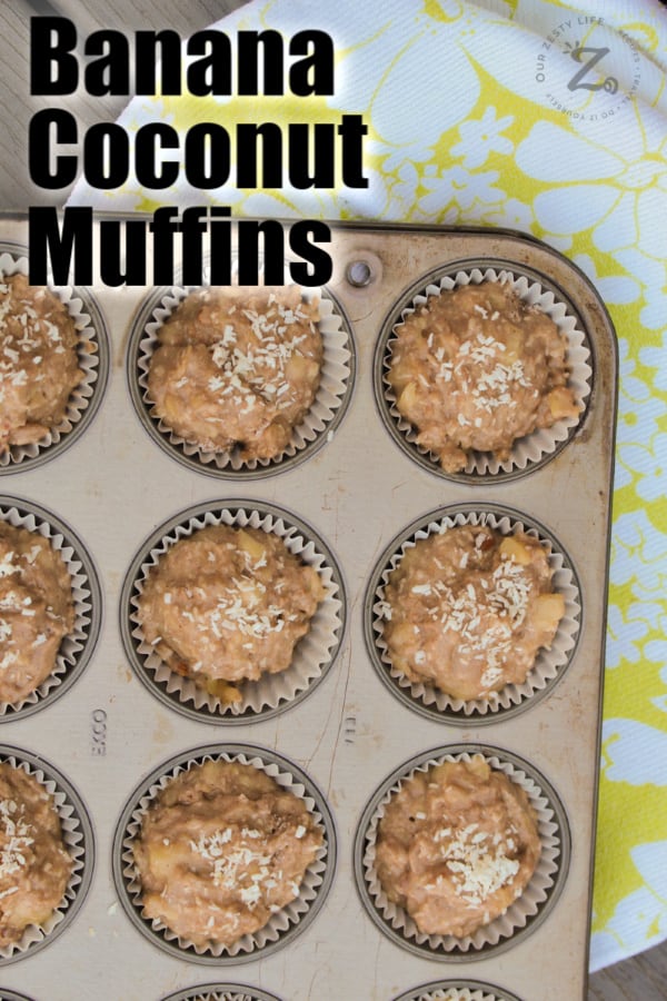 overhead view of unbaked banana coconut muffins in a muffin tin with a towel in the background