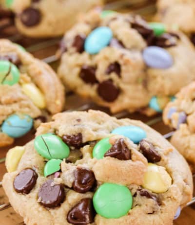 Side view of 5 M&M cookies on a baking rack