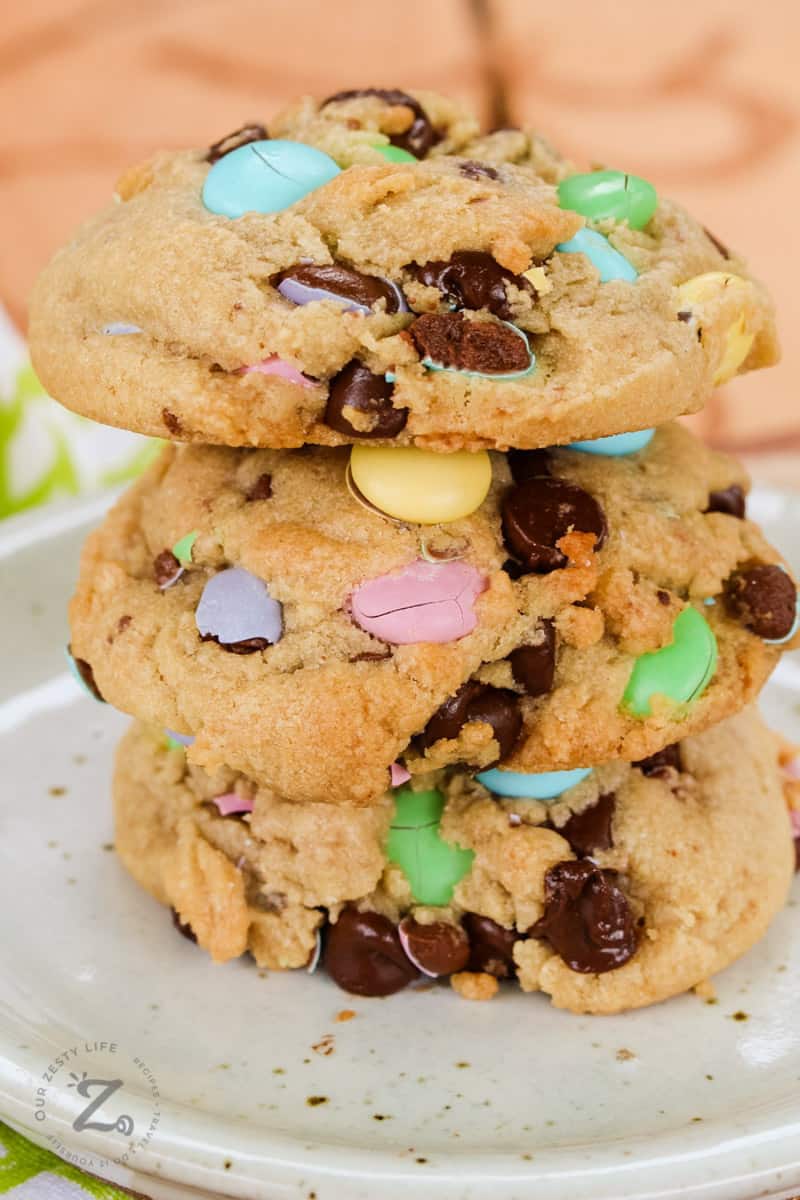 Side view of 3 M&M cookies stacked on top of each other