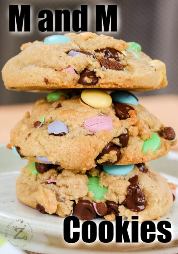 Side view of 3 M&M cookies stacked on top of each other