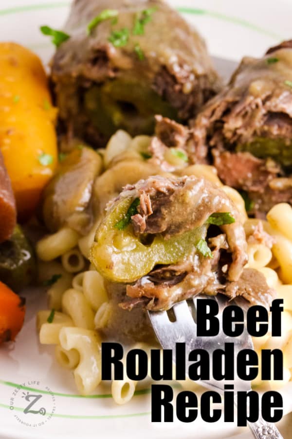 Beef Rouladen on a fork with writing