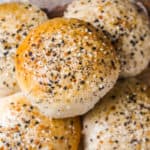 Hamburger buns in a pile with sesame seeds