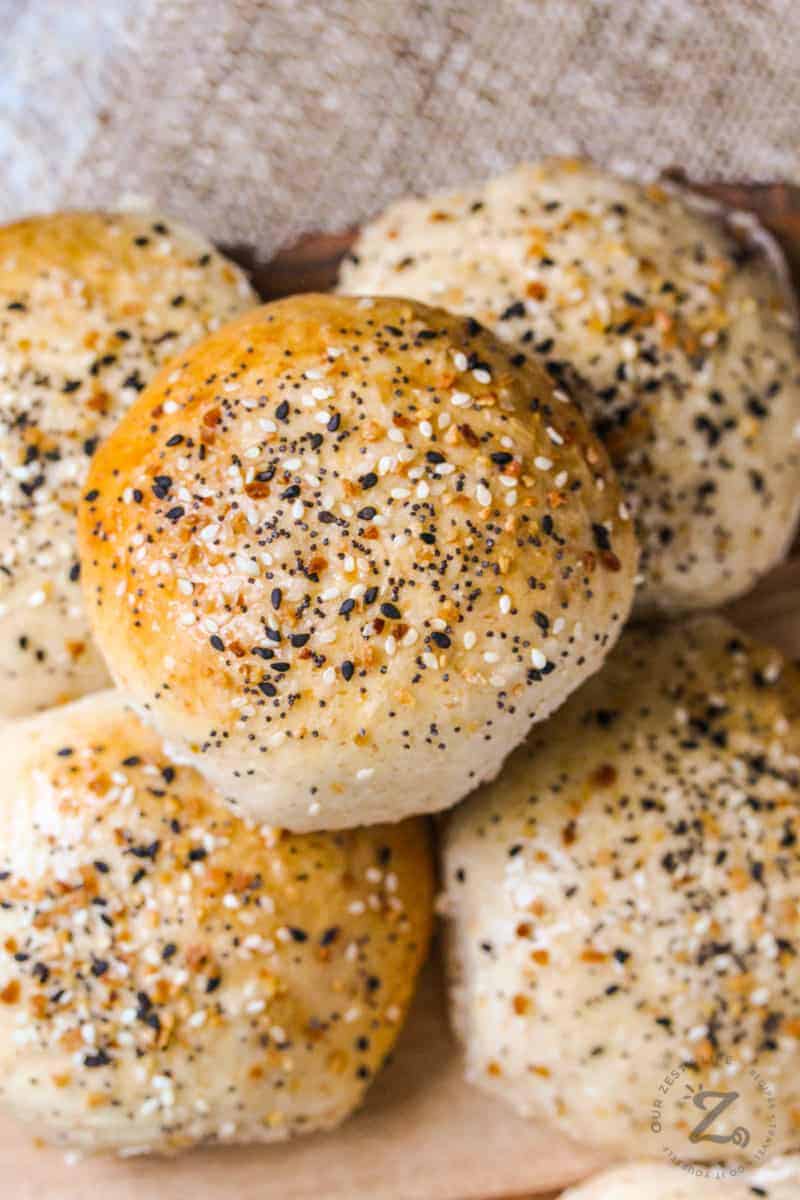 Hamburger buns in a pile with sesame seeds