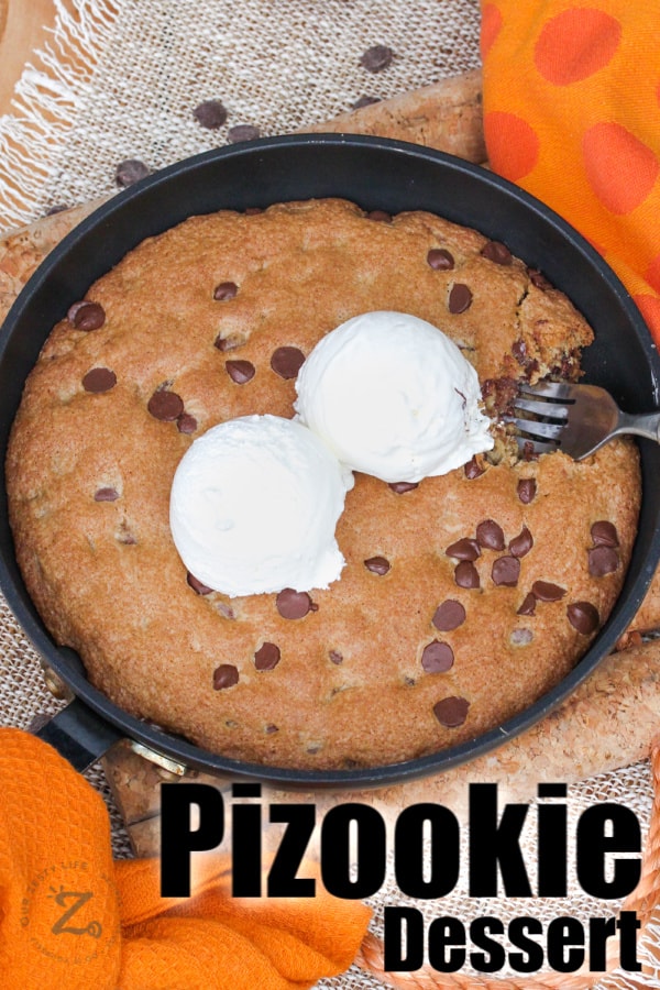 Pizookie in a pan with ice cream and a fork with a title