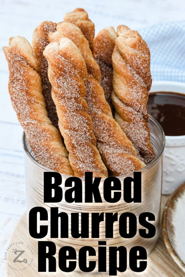 Baked Churros standing upright in a dish with writing