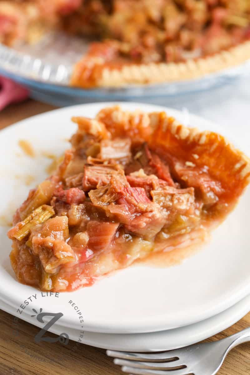 slice of Ginger Rhubarb Pie on a white plate