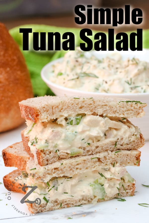 Tuna Salad on bread with bowl of tuna salad in background with writing