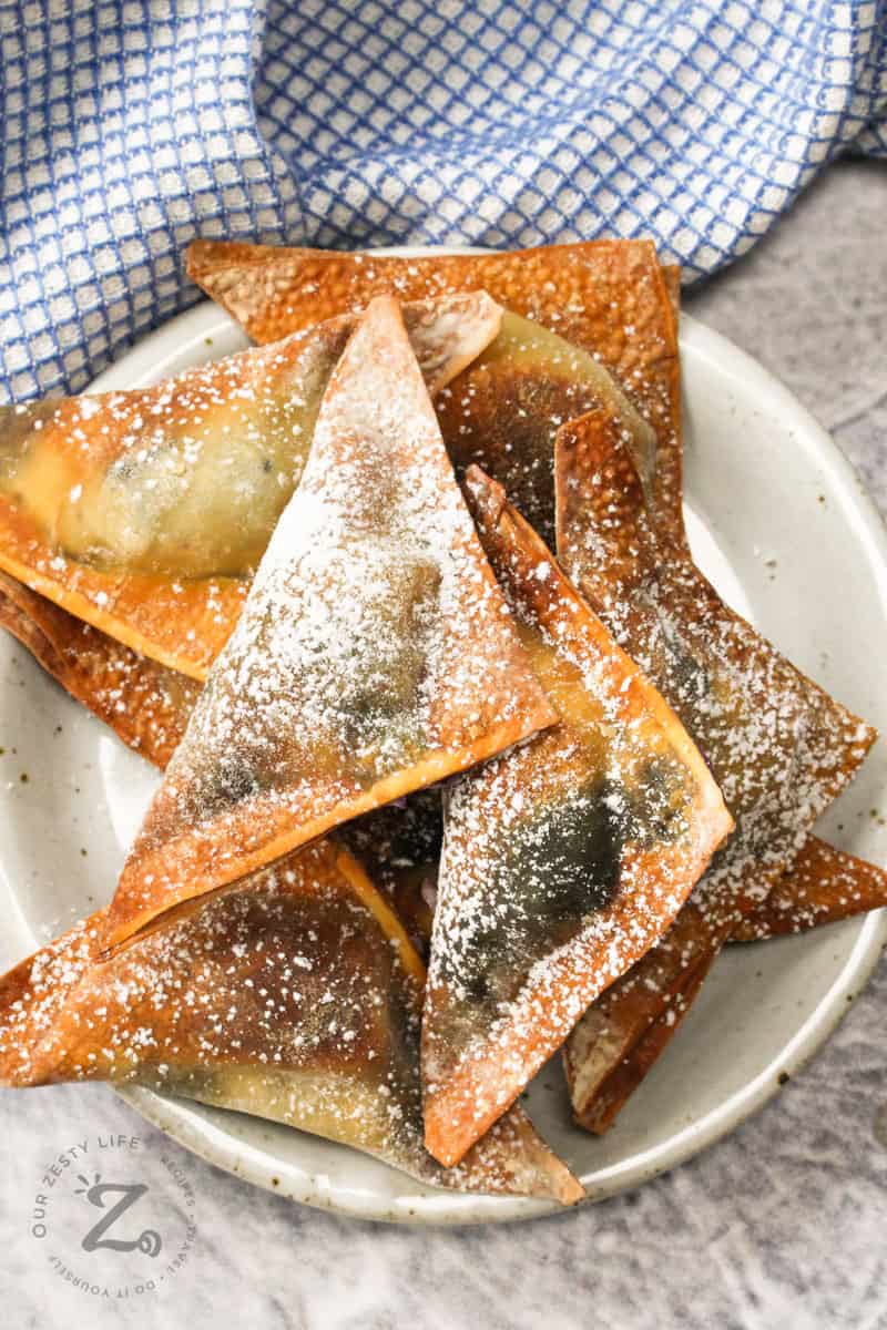 pile of Air Fryer Blueberry Wontons on a plate