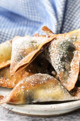close up of Air Fryer Blueberry Wontons on a plate