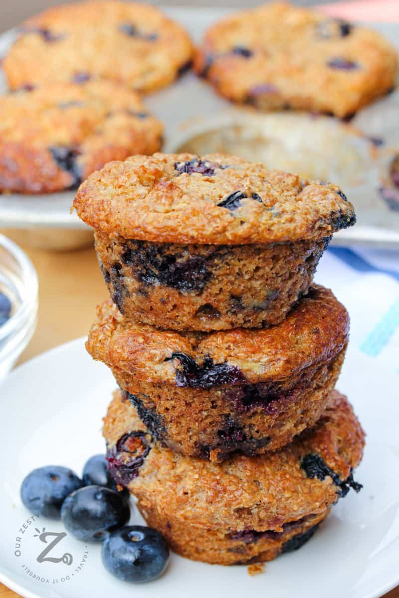 stacked Blueberry bran muffins on a plate