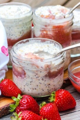 Overnight Oats with Strawberry Rhubarb Compote with a spoon in it
