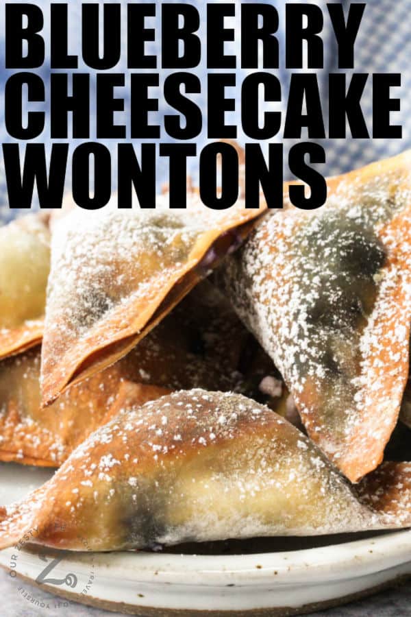close up of Air Fryer Blueberry Wontons on a plate with a title