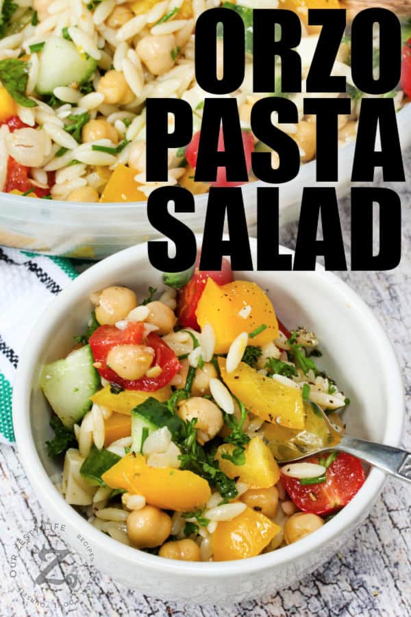 Orzo Pasta Salad in a bowl with a spoon and title