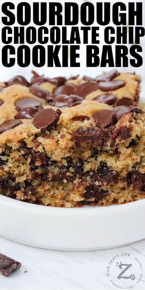 close up of Sourdough Chocolate Chip Cookie Bars in a dish with a title