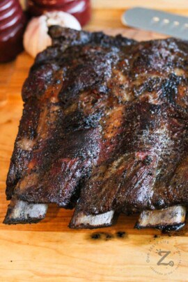 close up of Smoked Beef Ribs on wooden table