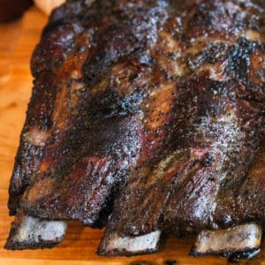 close up of Smoked Beef Ribs on wooden table