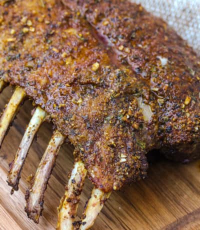 full Smoked Rack of Lamb on a wooden board