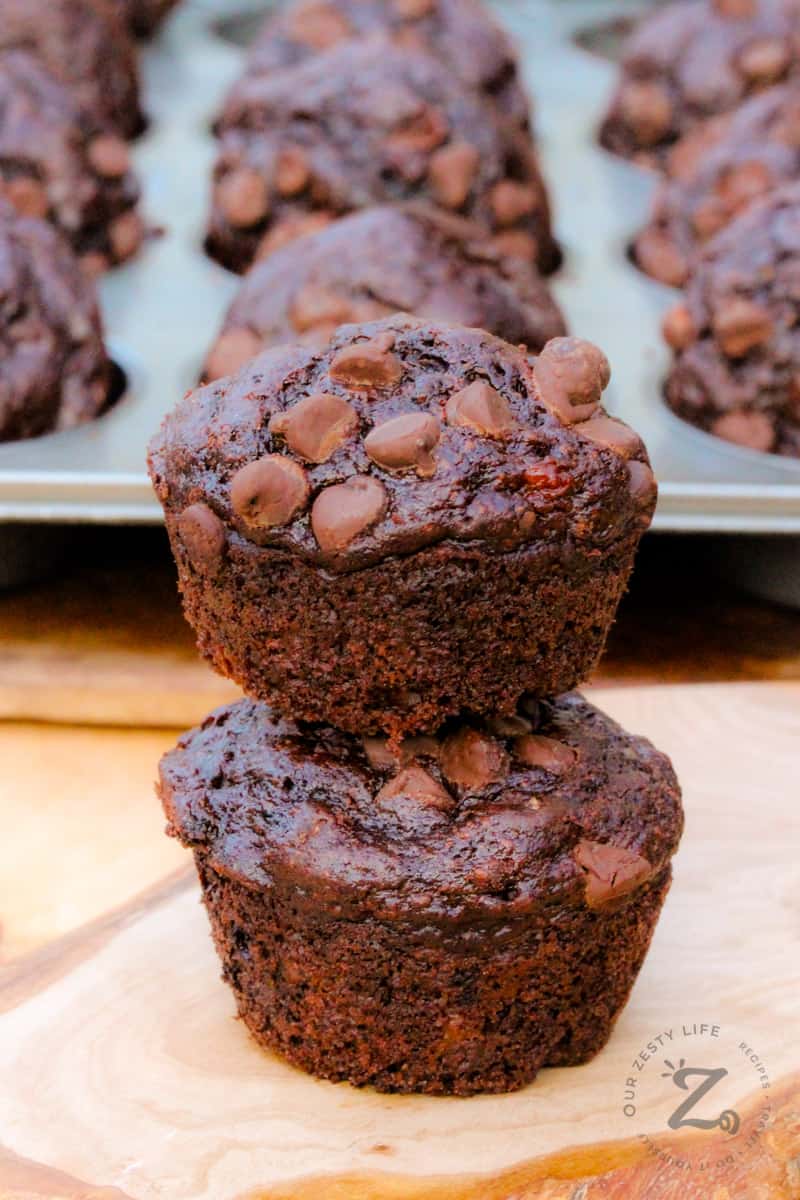 two Chocolate Zucchini Muffins in a pile