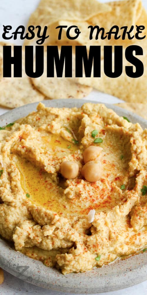 Hummus with chips and writing