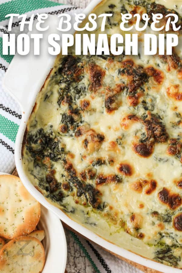 close up of Hot Spinach Dip with writing