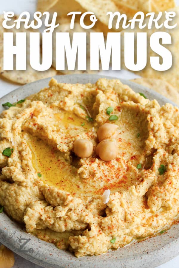 Hummus on a platter with writing