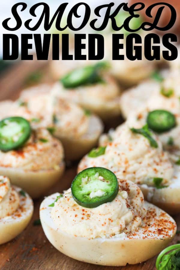 Smoked Deviled Eggs on a cutting board with a title