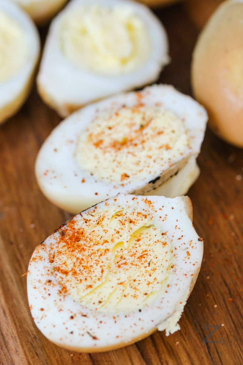 Smoked Hard Boiled Eggs on a wooden board with paprika