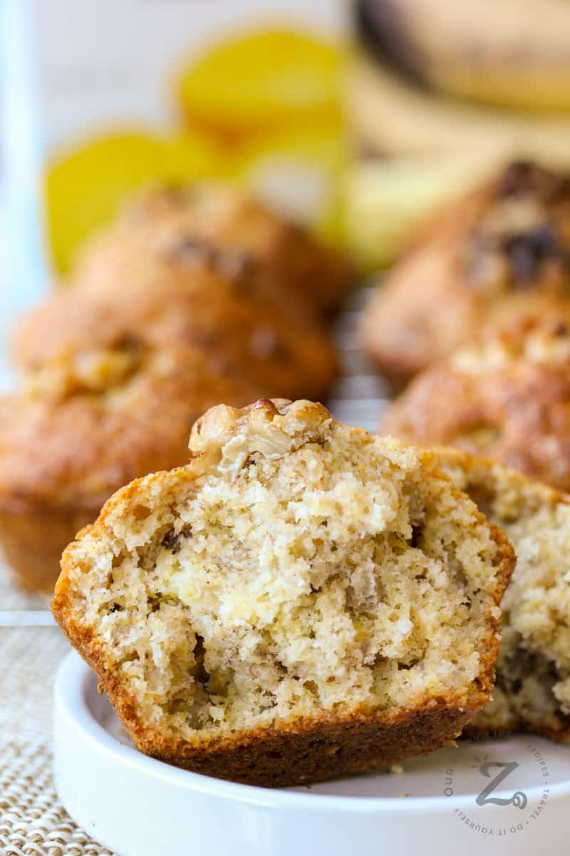 Banana Corn Muffins with one muffin sliced in half