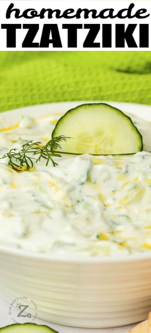 close up of Tzatziki with cucumber with writing