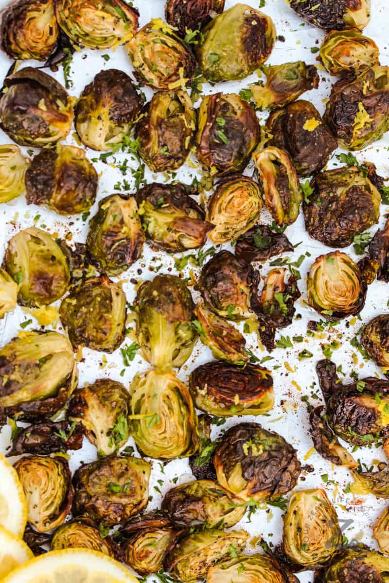 top view of cooked Crispy Brussels Sprouts on a sheet