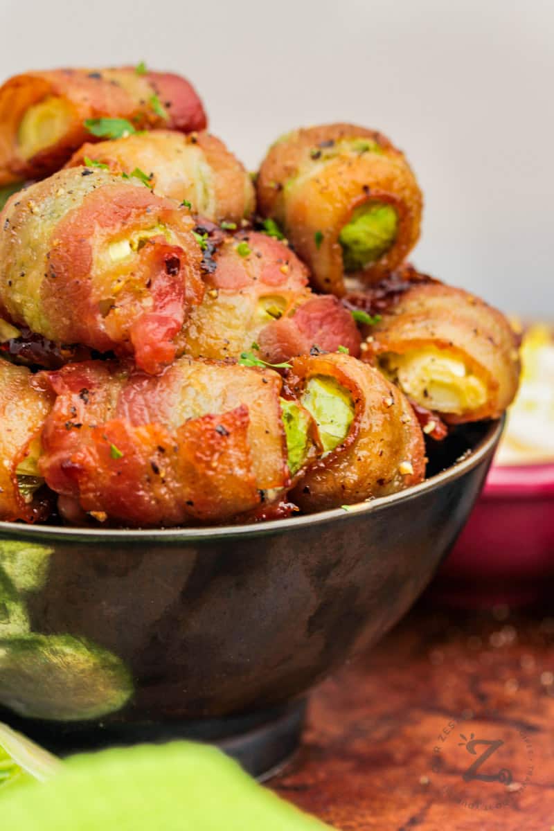 close up of Bacon Wrapped Brussel Sprouts in a bowl