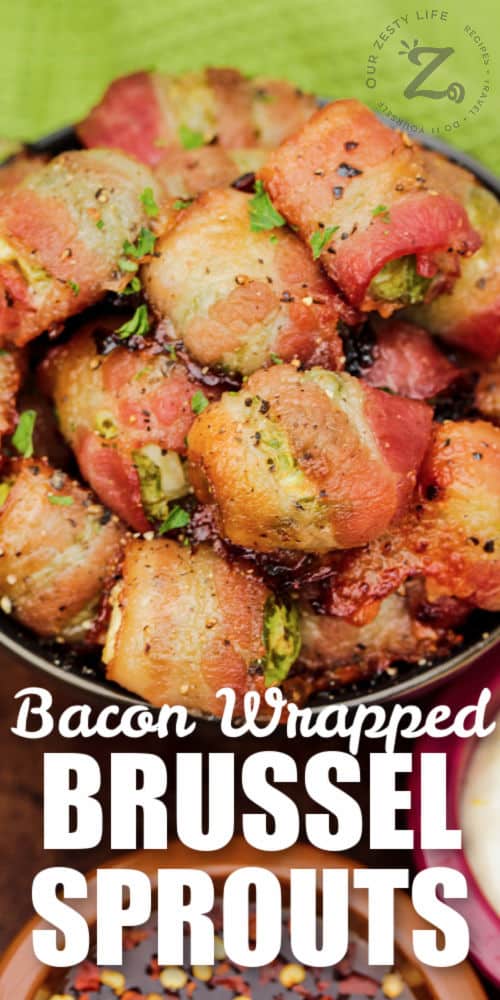 close up of Bacon Wrapped Brussel Sprouts in a bowl with writing