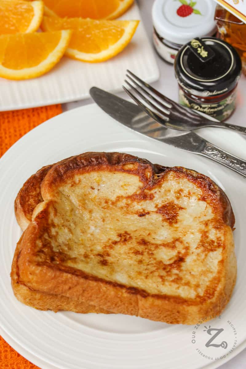 French Toast on a plate with orange slices