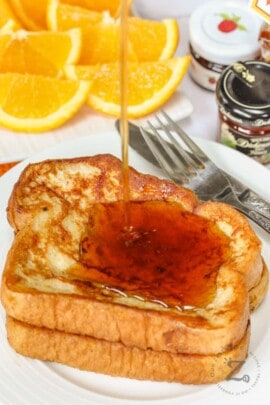 pouring syrup over French Toast