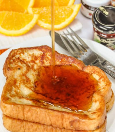 pouring syrup over French Toast