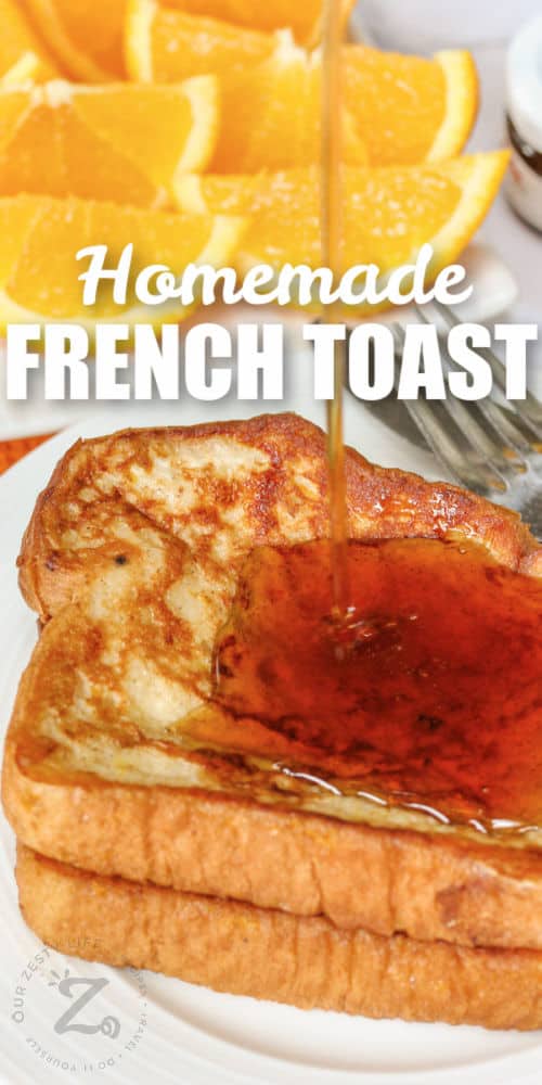 French Toast with syrup and oranges with writing