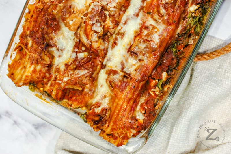 Spinach Lasagna cooked in a clear baking dish.