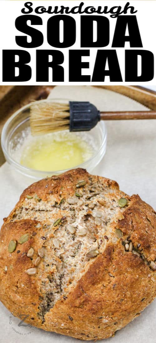 Sourdough Soda Bread loaf with bowl of melted butter and a title