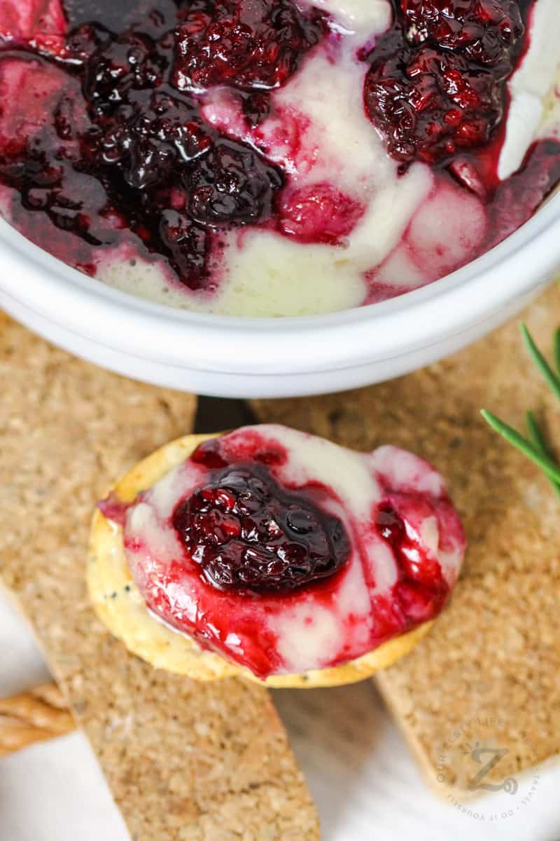 Baked Brie with Berries on a cracker