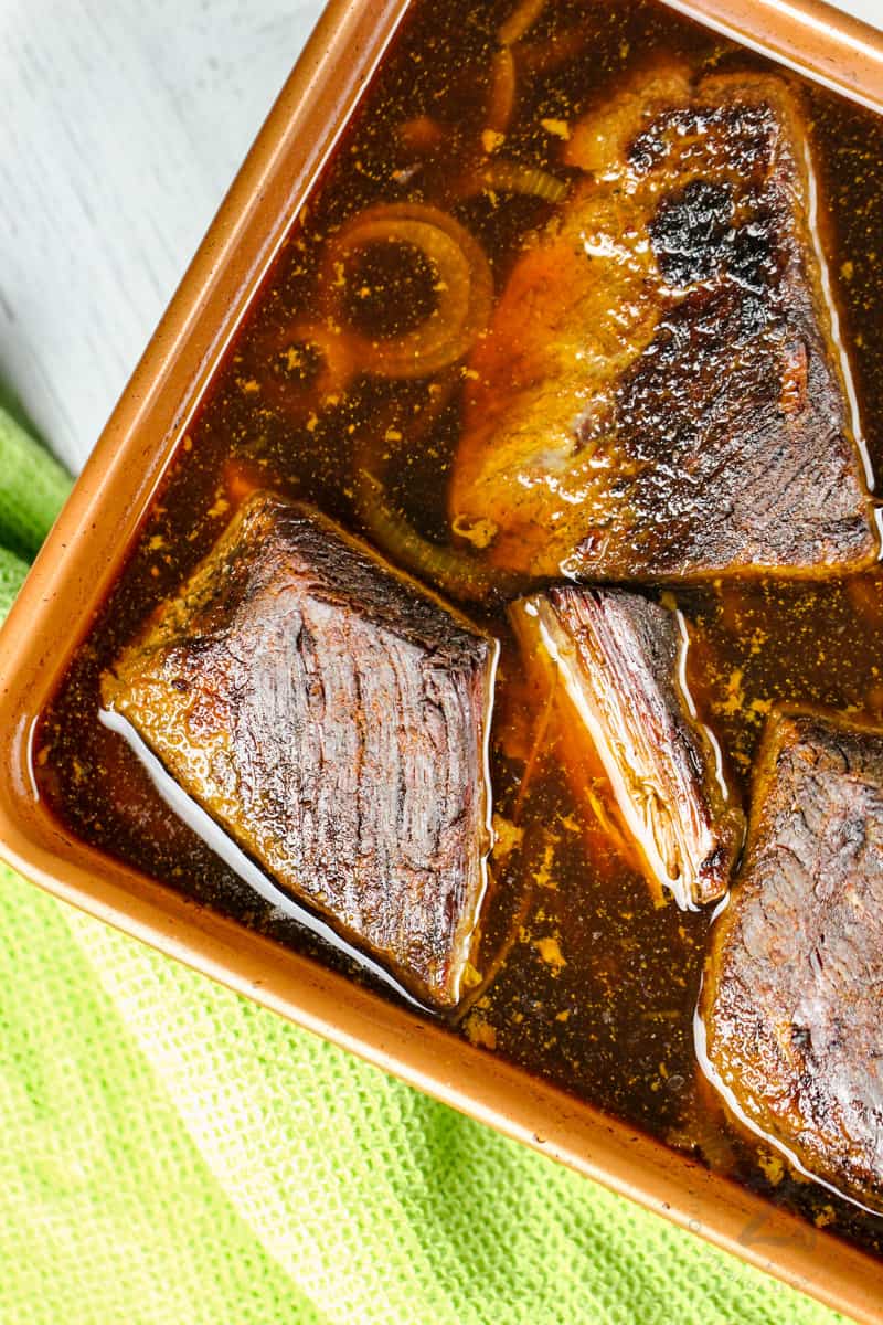 dish of cooked beef to make Beef Brisket Slow Cooker Recipe